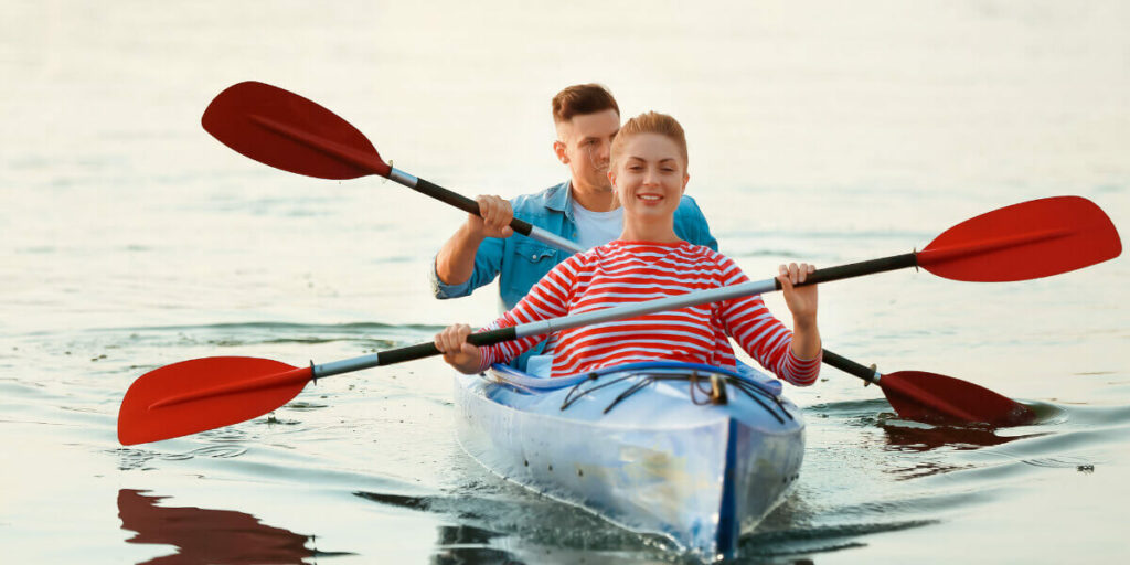 man and woman kayaking