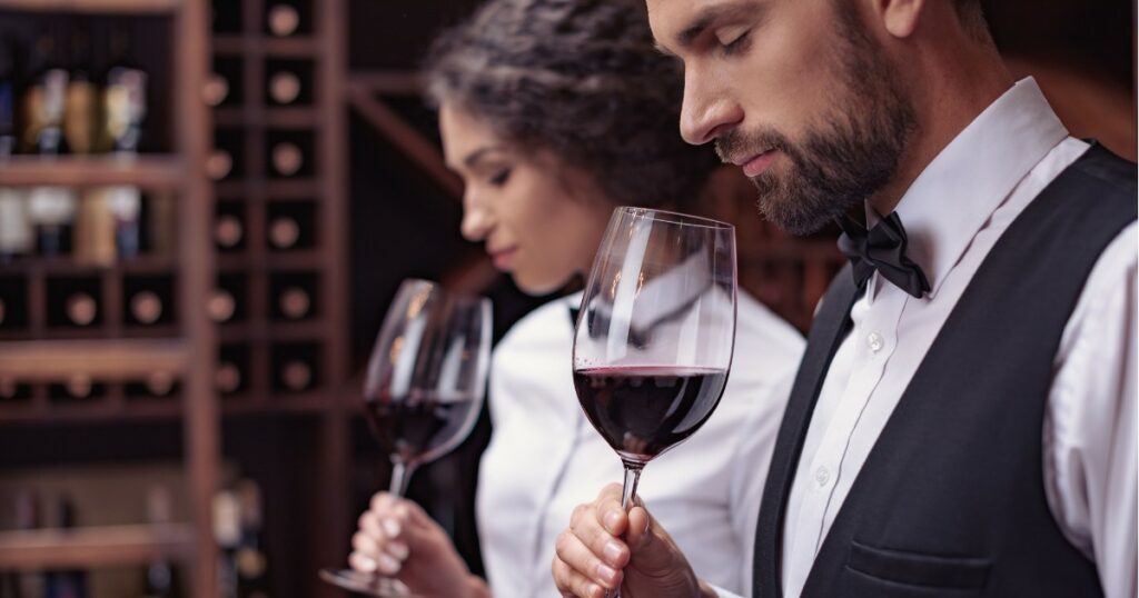 couple sniffing wine